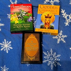 3 decks of oracle cards.